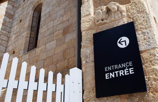 Entrance sign on the facade of an historical French monument