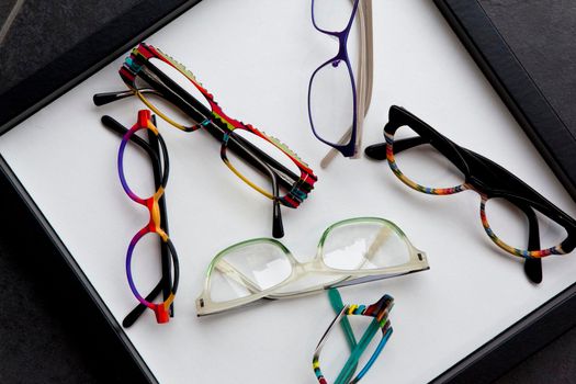 Various glasses on a tray in an optical shop