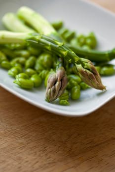 Asparagus and green beans on a plate
