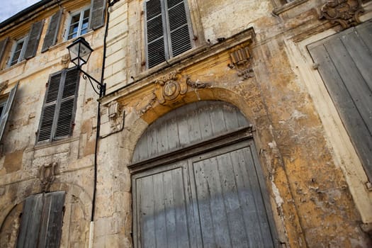 Facade of an old French mansion in a village