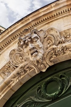 Stoned facade and sculpture of a French mansion in Bordeaux