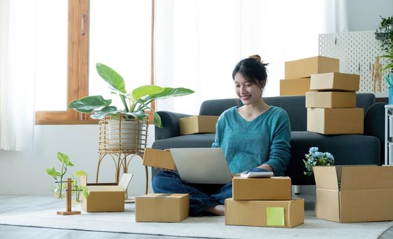 Portrait of young business asian woman online working in office desk use computer copyspace. Success business people employee, freelance SME online marketing work at home, coworking space concept.