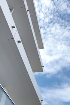 Close up of a facade and balcony of a modern residence in town