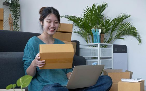 Portrait of young business asian woman online working in office desk use computer copyspace. Success business people employee, freelance SME online marketing work at home, coworking space concept.