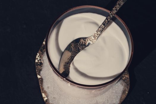 dairy and rustic farm food styled concept - fresh creamy white yogurt, elegant visuals