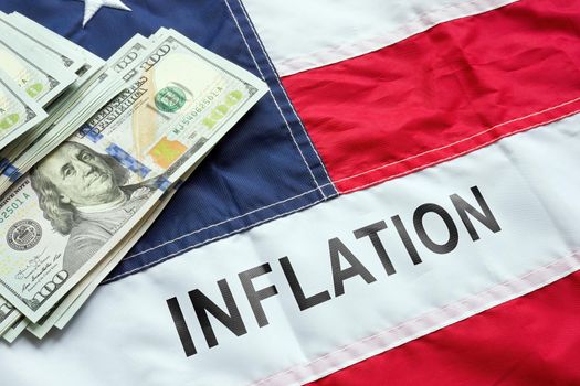 USA flag, the sign inflation on it and money.