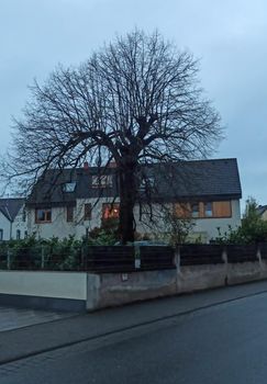 Old residential building in Germany. Cloudy and dusk. Gothic atmosphere.