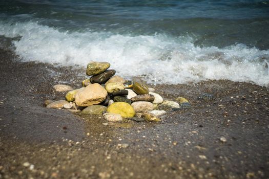 Summertime relax on the sand beach with sea waves