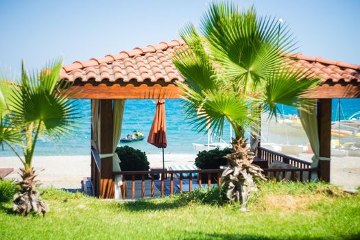 summertime relax on the sand beach with sea waves and beach cabin