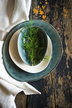 Festive table setting for Christmas dinner on dark rustic table with copyspace