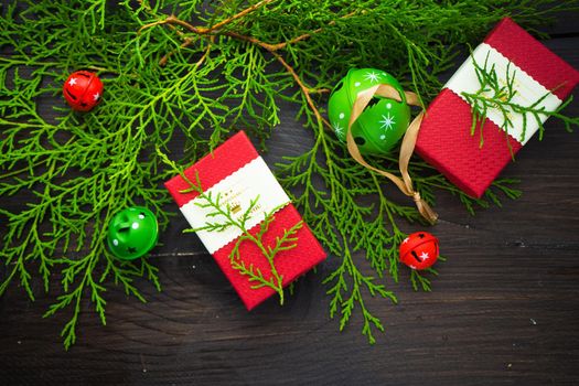Christmas sweets and gift boxes on rustic background with copyspace
