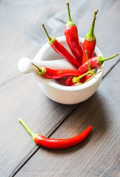 Red hot chilli peppers on dark background with copyspace