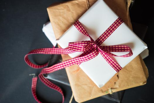 Christmas gift boxes on rustic background as a holiday concept with copyspace