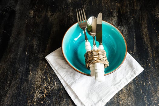 Rustic table setting with vintage tableware   on dark wooden  table with copyspace