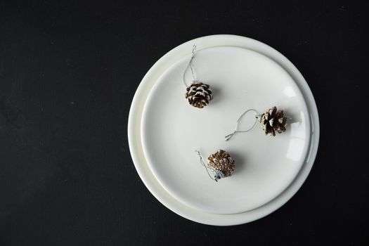Festive table setting for Christmas dinner on dark rustic table with copyspace