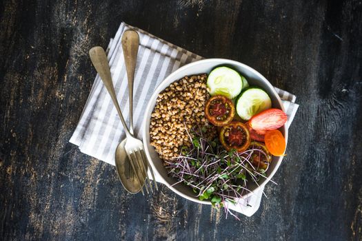 Budha bowl with fresh organic vegetables and red cabbage sprouts as a healthy food concept