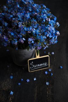 Summer floral concept with bright blue forget-me-not flowers