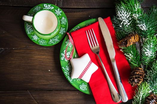 Festive table setting for Christmas holiday dinner with vintage flatware and decoration