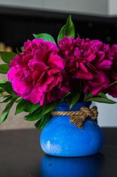 Purple peony flowers as a summer floral concept