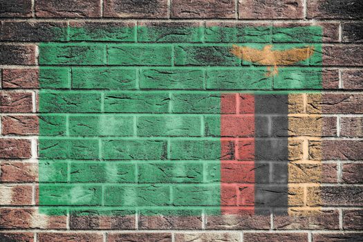 A Zambia flag on old brick wall background