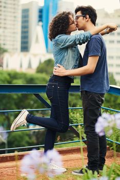 How lucky we are to have found love so young. a teenage couple kissing outdoors