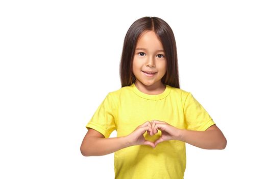 Little girl with her hands in heart-shaped isolated on the white background
