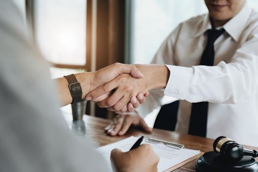 Guarantees, Mortgages, Signings, Insurance, contract, agreement concept, Real Estate Agents are shaking hands with customers to congratulate them after landing a deal.