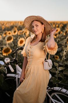 Attractive woman in timeless dress with retro styled bicycle in sunflowers field. Vintage fashion, amazing adventure, countryside activity, healthy lifestyle. High quality photo