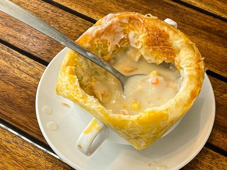 Chicken pot pie soup , zuppa toscana or bread or Tuscan or Minestra Pane or Zuppa soup. Made from kale, zucchini, beans, potatoes, celery, carrots, onion, tomato pulp, extra virgin olive oil, chili and chicken or bacon.