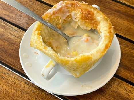 Chicken pot pie soup , zuppa toscana or bread or Tuscan or Minestra Pane or Zuppa soup. Made from kale, zucchini, beans, potatoes, celery, carrots, onion, tomato pulp, extra virgin olive oil, chili and chicken or bacon.