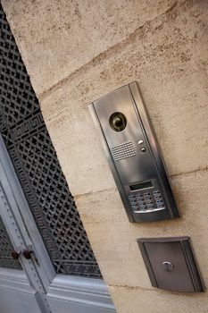 Modern intercom on a stoned facade of a French mansion