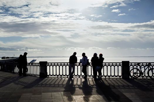 People on a deck facing the sea in South-West of France