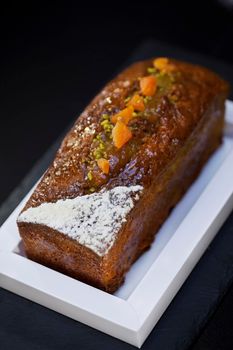 Cake with apricot and pistachio on a dish