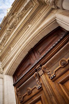 Stylish wooden door of a French mansion in Bordeaux