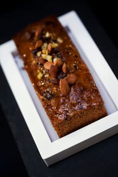 Almond cake and dried fruit on a dish