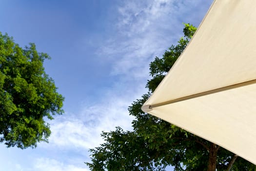 Close up of canvas beach umbrella in a park