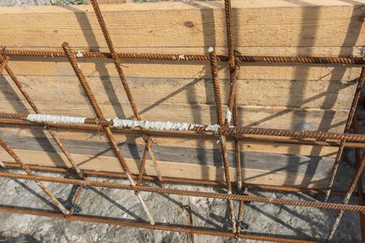 Tied reinforcement and mounted strip foundation formwork close-up a
