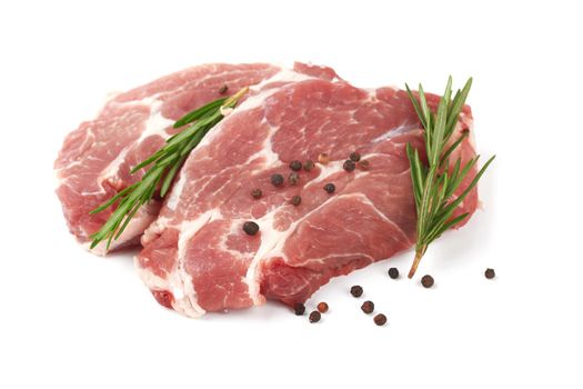 Raw meat with rosemary on a white background