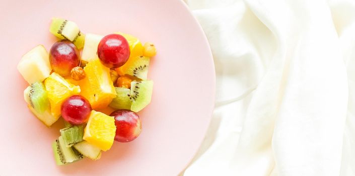juicy fruit salad on silk, flatlay - healthy lifestyle and breakfast in bed styled concept