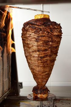 delicious trompo al pastor (shepherd's style). Mexican taco with salsa, taco al pastor