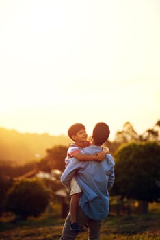 The best place to be is anywhere with Dad. a father and his little son bonding together outdoors