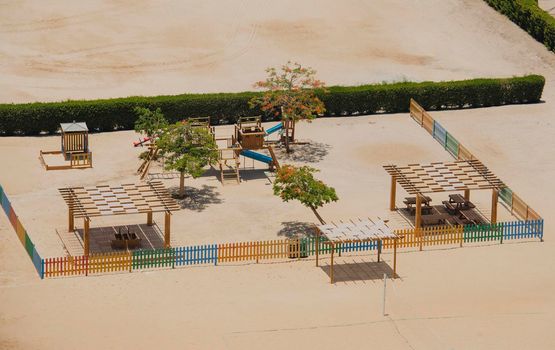 Aerial view of wooden frame structure in children's playground area of luxury tropical hotel
