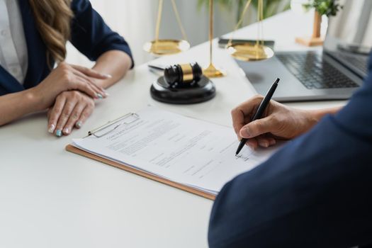 Business people negotiating a contract. Human hands working with documents at desk and signing contract