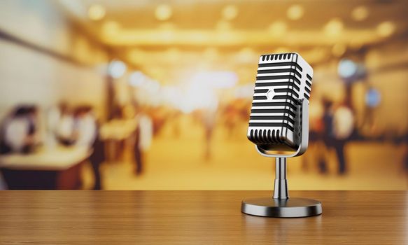 Close up of old vintage style podcast microphone in convention hall and blurry people background. Entertainment and conference concept