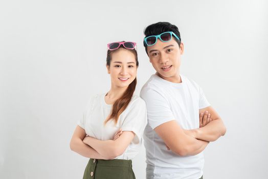 young couple smiling at the light on a light background