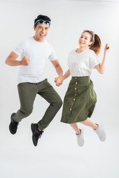 Full length shot of jumping couple having fun together.