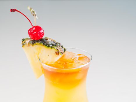 Colorful bright cocktail decorated with ice, sugar and fruit. Cooling drink. Fresh beverage