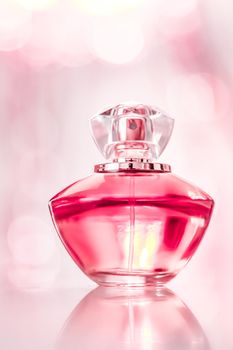 Perfume bottle on glamour background, floral feminine scent, fragrance and eau de parfum as luxury holiday gift, cosmetic and beauty brand present concept