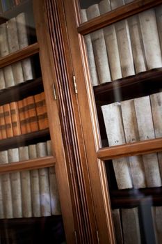 Wooden bookcase and old books