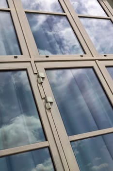 Aluminum windows and cloudy sky on background